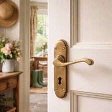 Additional picture of Coronet Door Handles Lock Plate Antique Satin Brass