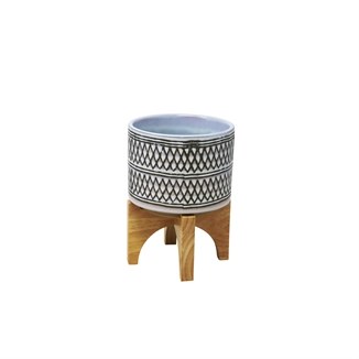 7" White and Black Pot With a Wood Stand