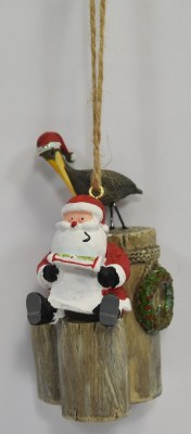 Santa Sitting With a Pelican Ornament