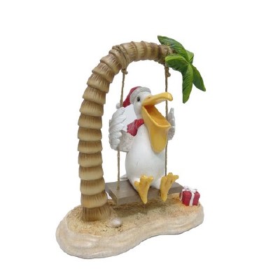 11" Polyresin Christmas Pelican on a Palm Tree Swing Statue