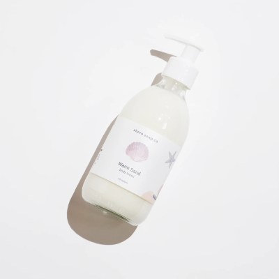 10 Oz Warm Sand Fragrance Body Lotion in a Glass Bottle