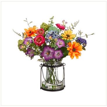 artificial flowers in glass vase