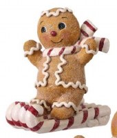 6" Polyresin Gingerbread Man Riding Candy Cane Sleigh Figurine