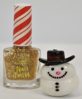 Gold Nail Polish With a Squishy Snowman Ring by Mud Pie