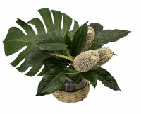 18" Faux Protea and Tropical Leaves in a Glass Vase Wrapped With Rattan