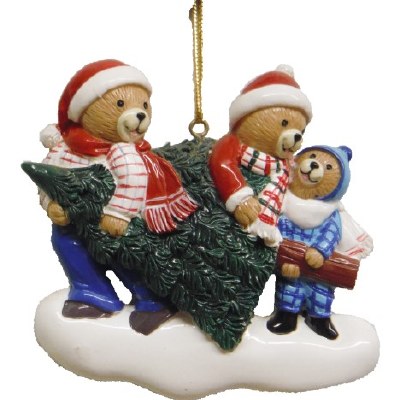 A FAMILY OF 3 CARRING CHRISTMAS TREE