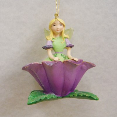 FAIRY SITTING ON FLOWER