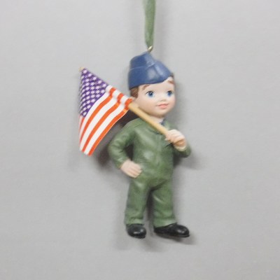 BOY DRESSED IN NAVY UNIFORM