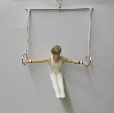 MALE GYMNIST ON RINGS