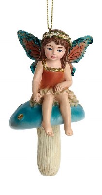 BROWN FAIRY ON MUSHROOM