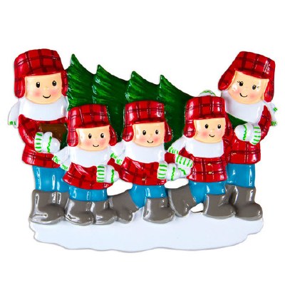 FAMILY OF 5 CARRING CHRISTMAS TREE