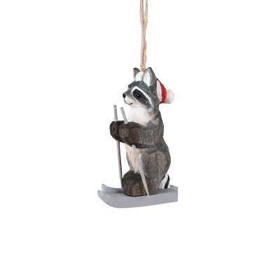 CARVED WOODEN RACCOON ON SKIES