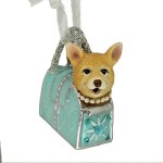 TAN DOG IN BLUE PURSE