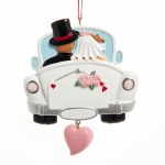BRIDE & GROOM IN CAR