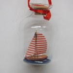 RED SAIL BOAT  IN A BOTTLE