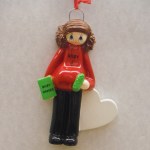 WOMAN W/BABY NAME BOOK