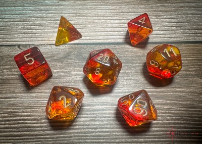 Chessex Gemini Poly 7-Die Set Translucent Red-Yellow/Gold