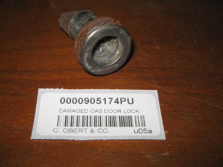 DAMAGED GAS DOOR LOCK ASSEMBLY