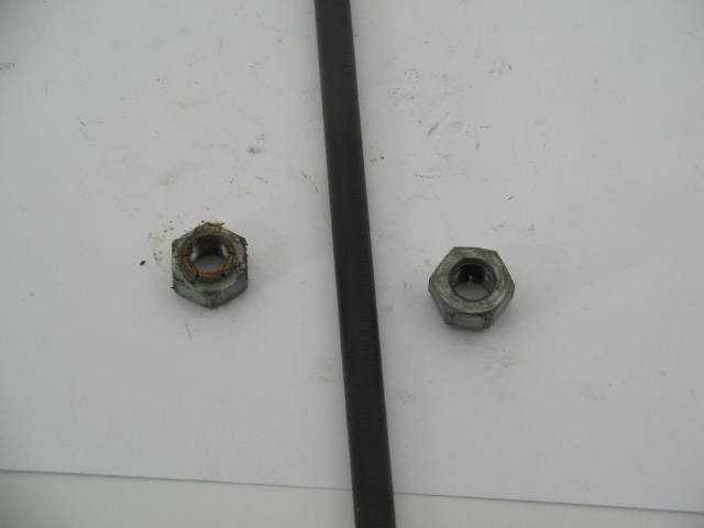 ROCKER ARM STAND TO HEAD NUT