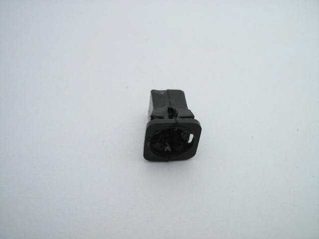 PLASTIC PLUG IN REAR PANEL