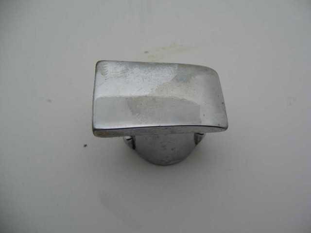 CHROME PLUG AT TOP OF ARMREST