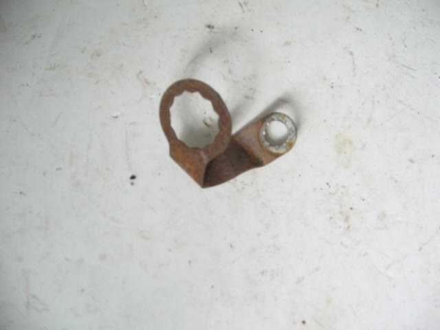 LEFT BRAKE HOSE RETAINER
