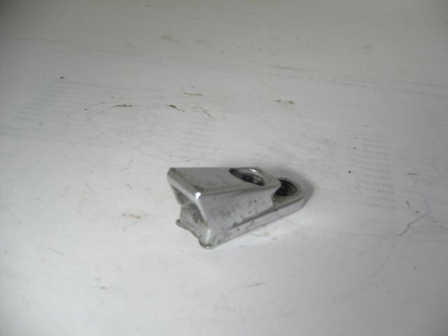 TOP CATCH ON WINDSHIELD FRAME