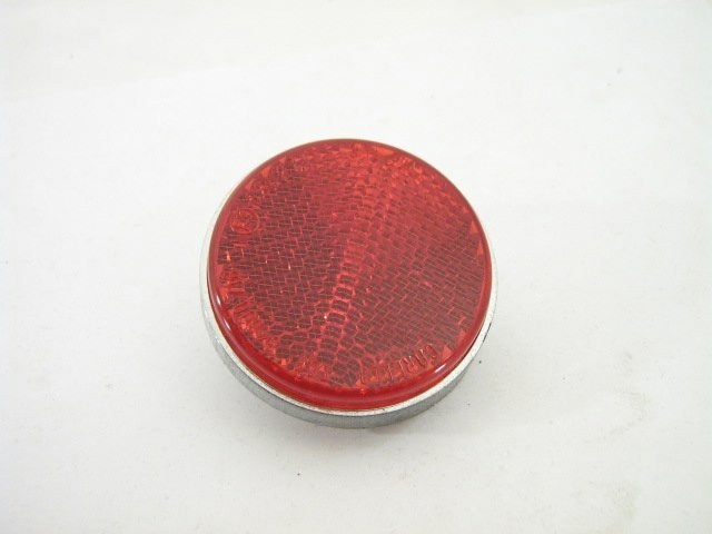 LEFT ROUND REFLECTER ON REAR