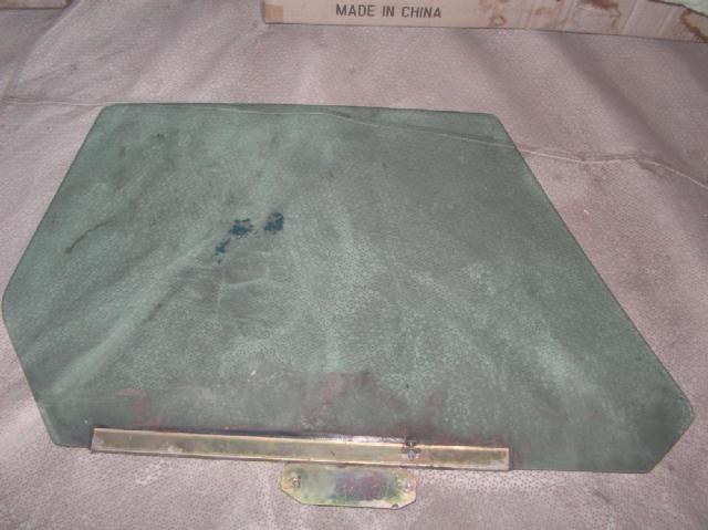 LEFT TINTED DOOR WINDOW