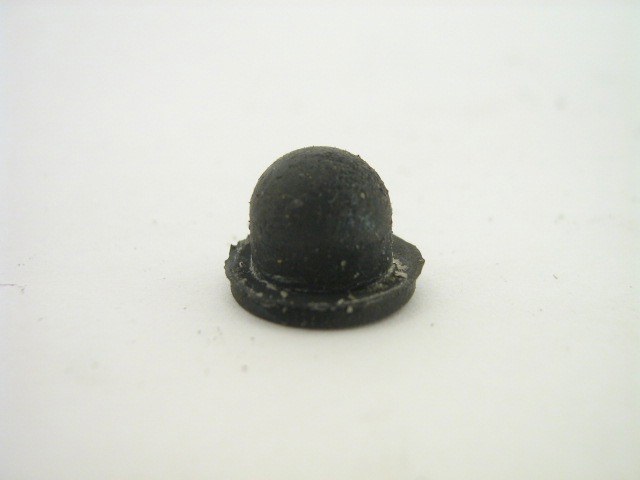 RUBBER PLUG IN BACKING PLATE