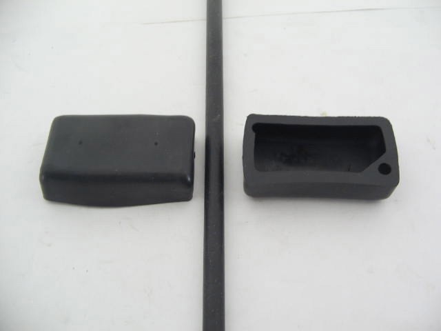 RUBBER COVER BEHIND DOOR LATCH