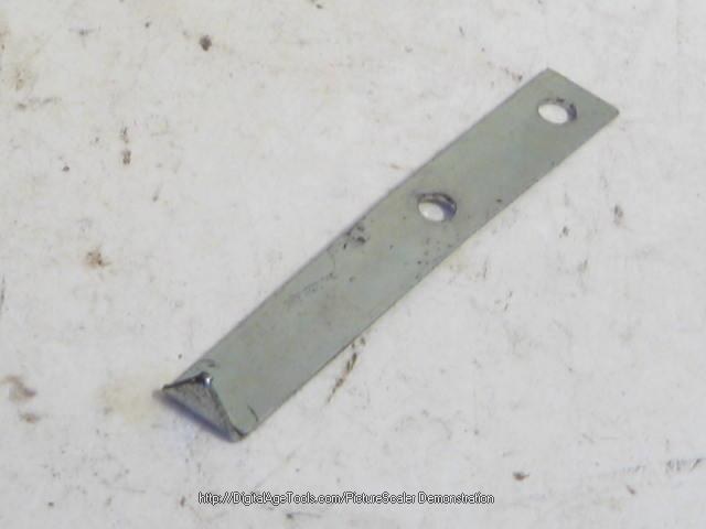 CLIP TO RETAIN HEADLAMP DOOR