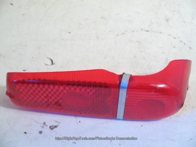 RIGHT TAIL LAMP LENS, DAMAGED!