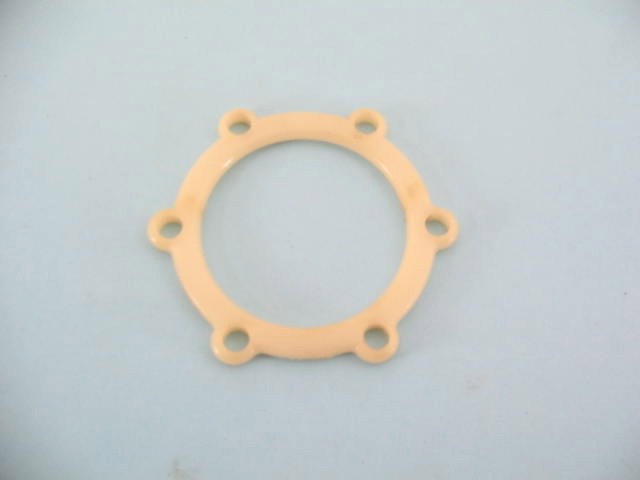 FUEL PUMP SPACER AT DIAPHRAGM