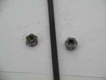 ROCKER ARM STAND TO HEAD NUT