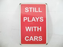 STILL PLAYS WITH CARS SIGN