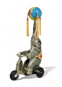 TIN TOY ELEPHANT ON BIKE