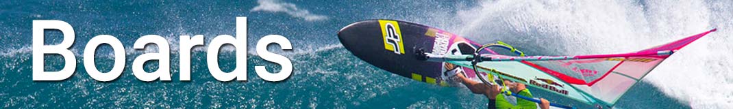 Windsurfer riding his board practically inverted on the crest of a wave!