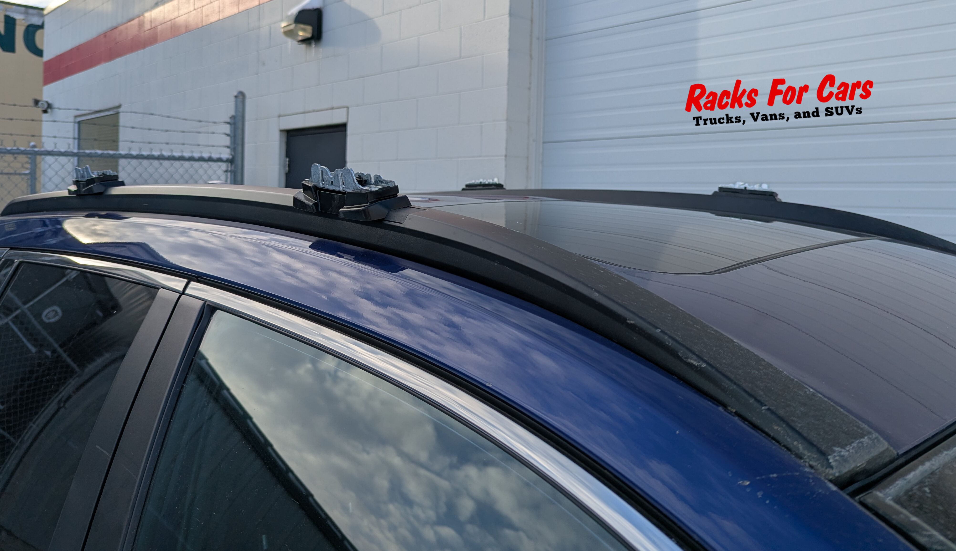 A close up picture of the Thule 7101 Fixed Point Fit Kit installed on a 2025 Toyota Corolla Cross