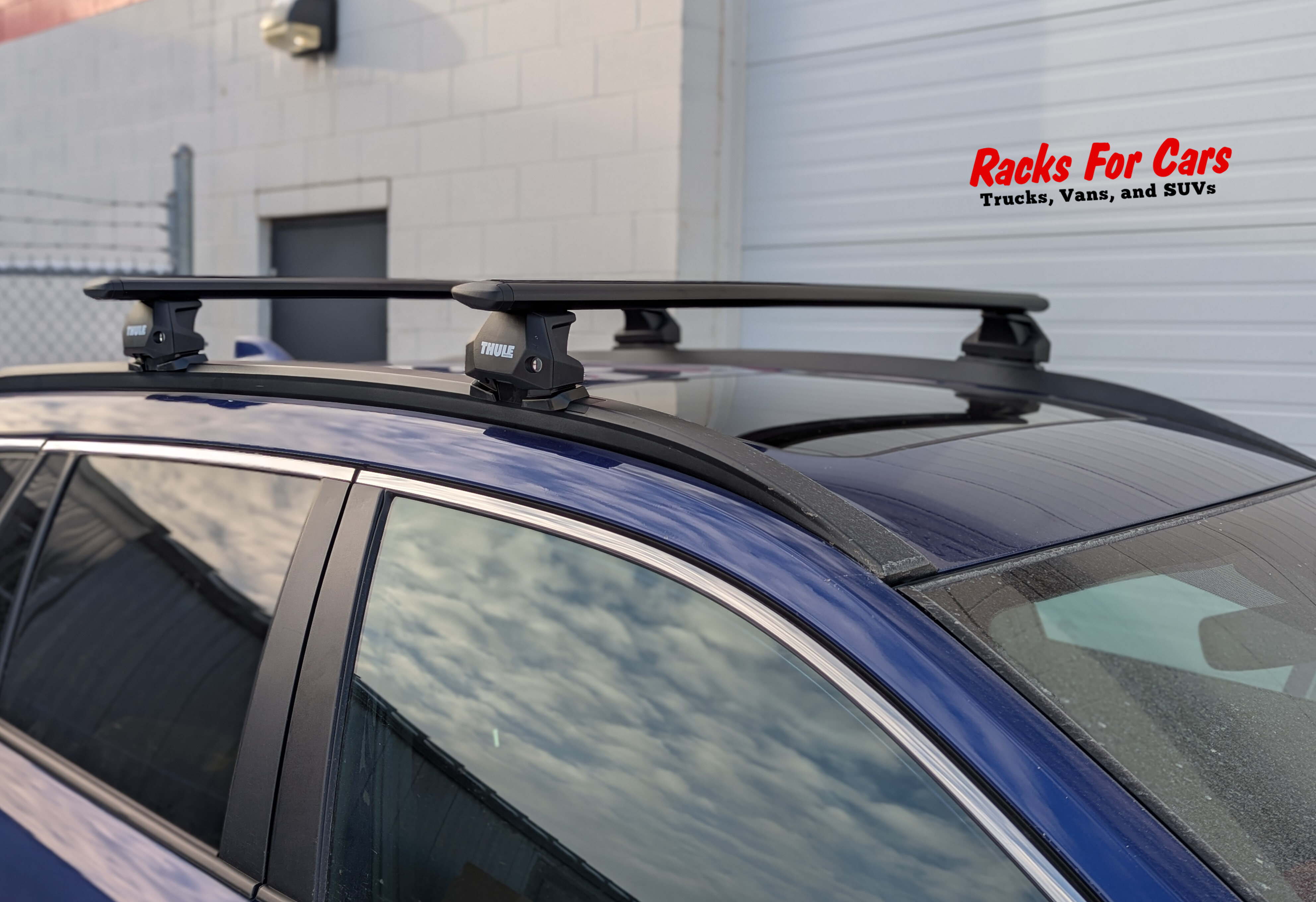 A closee up picture of a Thule WingBar Evo roof rack installed on a 2025 Toyota Corolla Cross