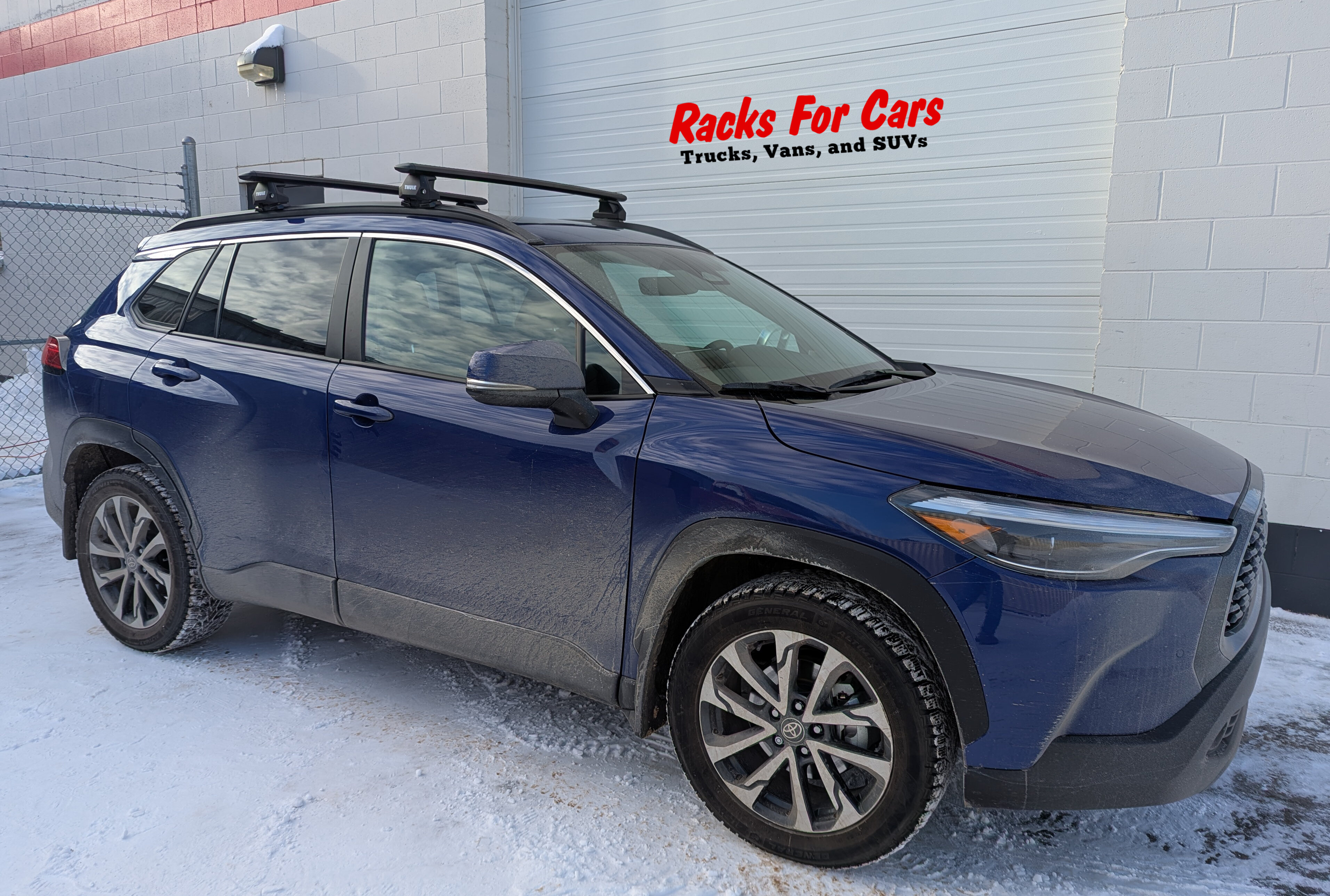 Picture of a Thule WingBar Evo roof rack installed on a 2025 Toyota Corolla Cross