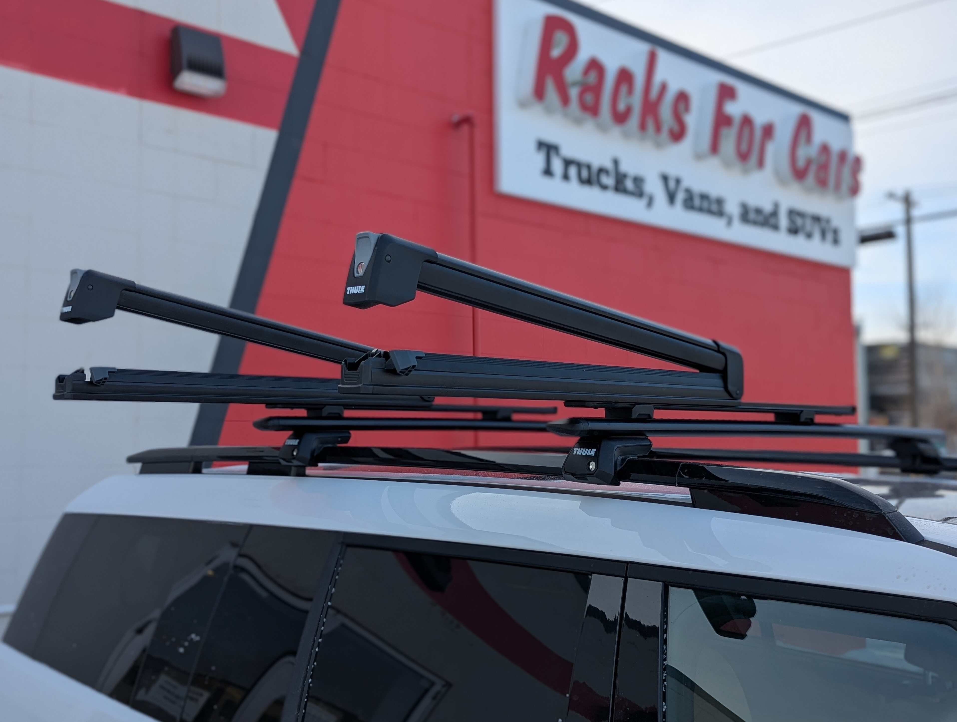 A picture of the Thule SnowPack Extender ski rack in the open slid out position