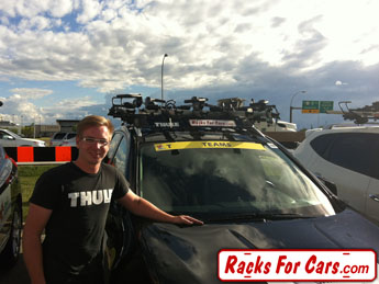 Tour of Alberta roof bike racks on team vehicles from Racks For Cars