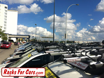 Tour of Alberta roof bike racks on team vehicles from Racks For Cars