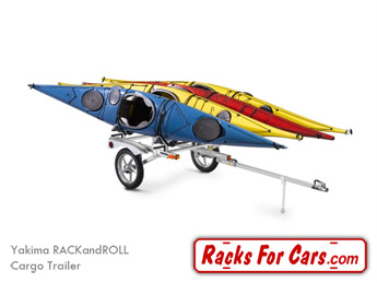 Yakima RACKandROLL Cargo Trailer for carrying bikes, kayaks, canoes, and cargo boxes towed behind a vehicle with four kayaks in Yakima BowDown J-style kayak racks