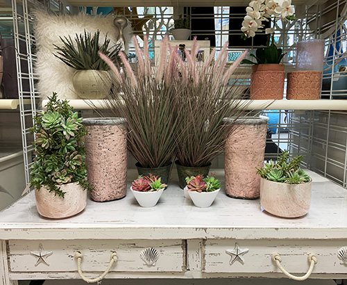 shelf with pots and faux plants