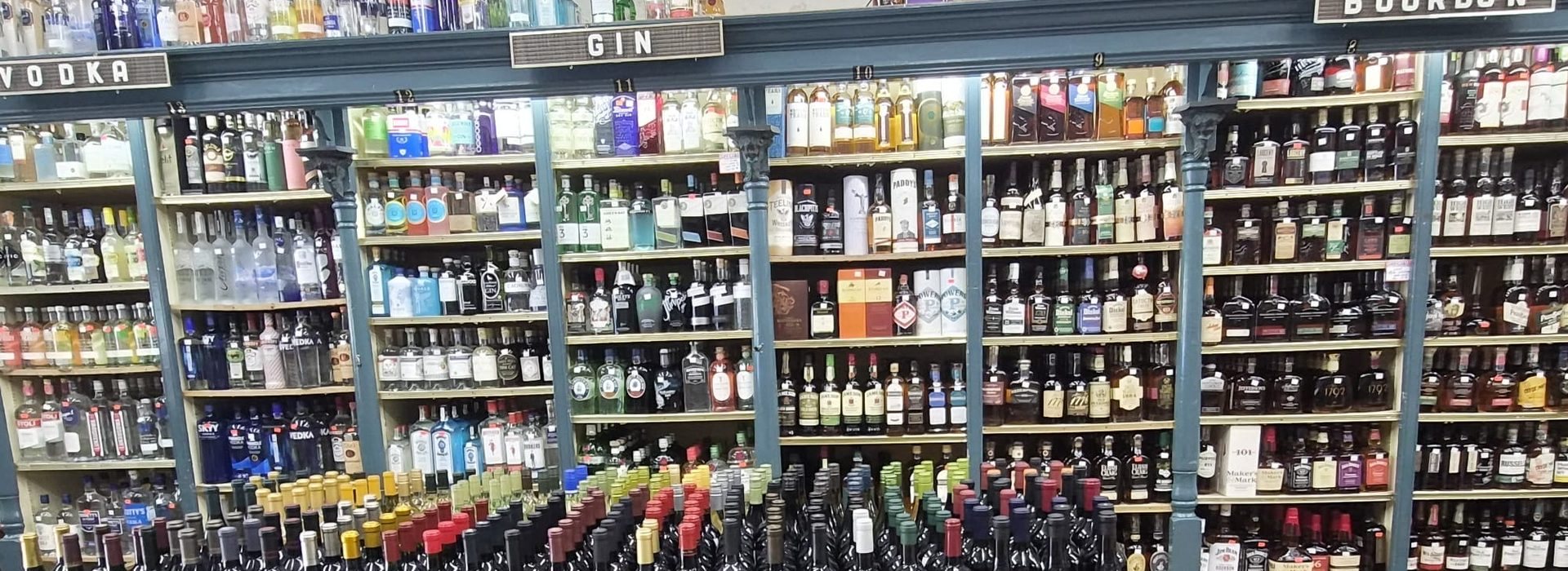 Wall of premium spirits and bourbon bottles at Chevy Chase Wine & Spirits