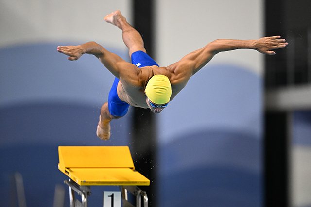 Diver leaping off a board